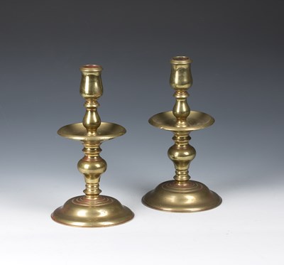 Lot 282 - Pair of brass candlesticks with wide circular...