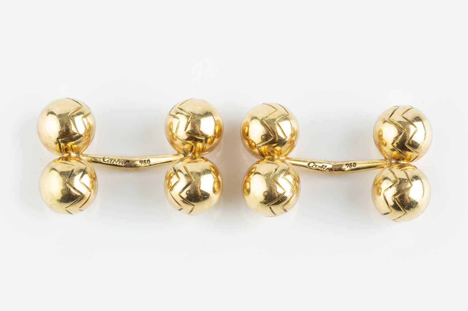 Lot 105 - A pair of cufflinks, each with chevron...