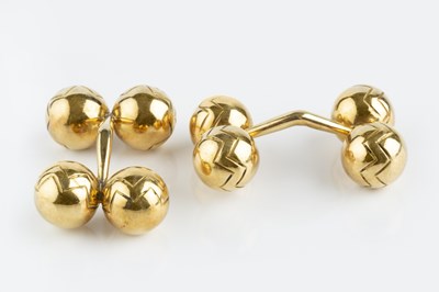 Lot 105 - A pair of cufflinks, each with chevron...