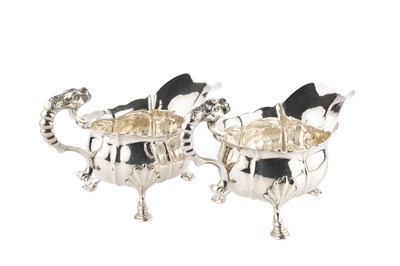 Lot 387 - A pair of George II silver sauce boats, each...