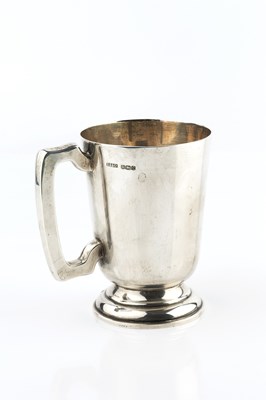 Lot 396 - A silver mug, with tapered body, angular...