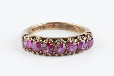 Lot 90 - A ruby half hoop ring, designed as a line of...