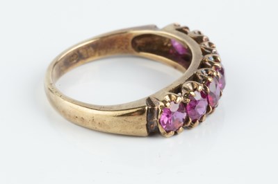 Lot 90 - A ruby half hoop ring, designed as a line of...