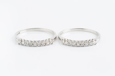 Lot 189 - A pair of diamond half hoop rings, each...