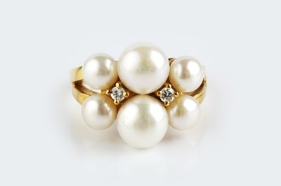 Lot 151 - A cultured pearl and diamond dress ring,...