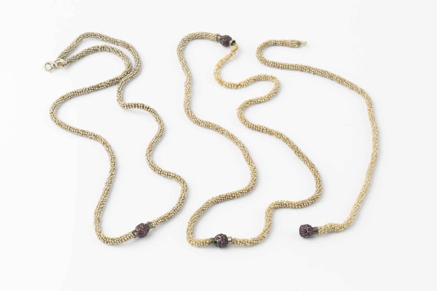 Lot 106 - Three seed pearl necklaces with gem set clasps,...