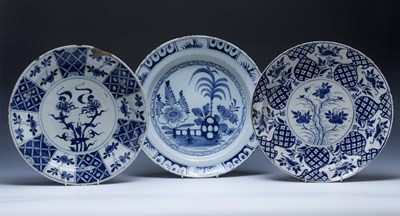 Lot 324 - Three Delft blue and white chargers Dutch,...