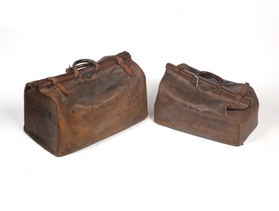 Lot 230 - Two old leather Gladstone bags, the larger...