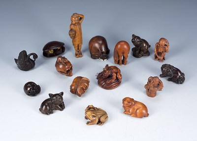 Lot 371 - Group of carved wood netsukes Japanese,...