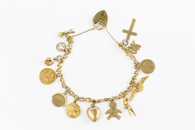 Lot 57 - A charm bracelet, the fancy curb-link bracelet...