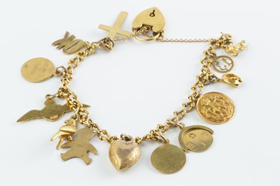 Lot 57 - A charm bracelet, the fancy curb-link bracelet...