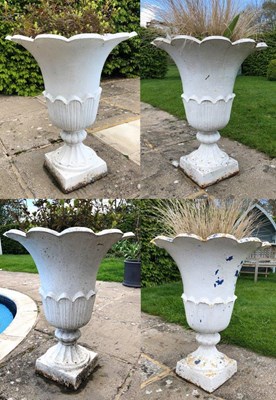 Lot 682 - A set of four Victorian cast iron urns of...