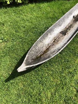 Lot 685 - An antique dugout canoe, with two paddles,...