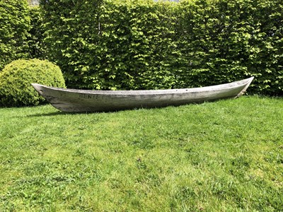 Lot 685 - An antique dugout canoe, with two paddles,...