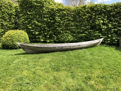 Lot 685 - An antique dugout canoe, with two paddles,...