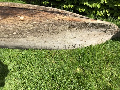 Lot 685 - An antique dugout canoe, with two paddles,...