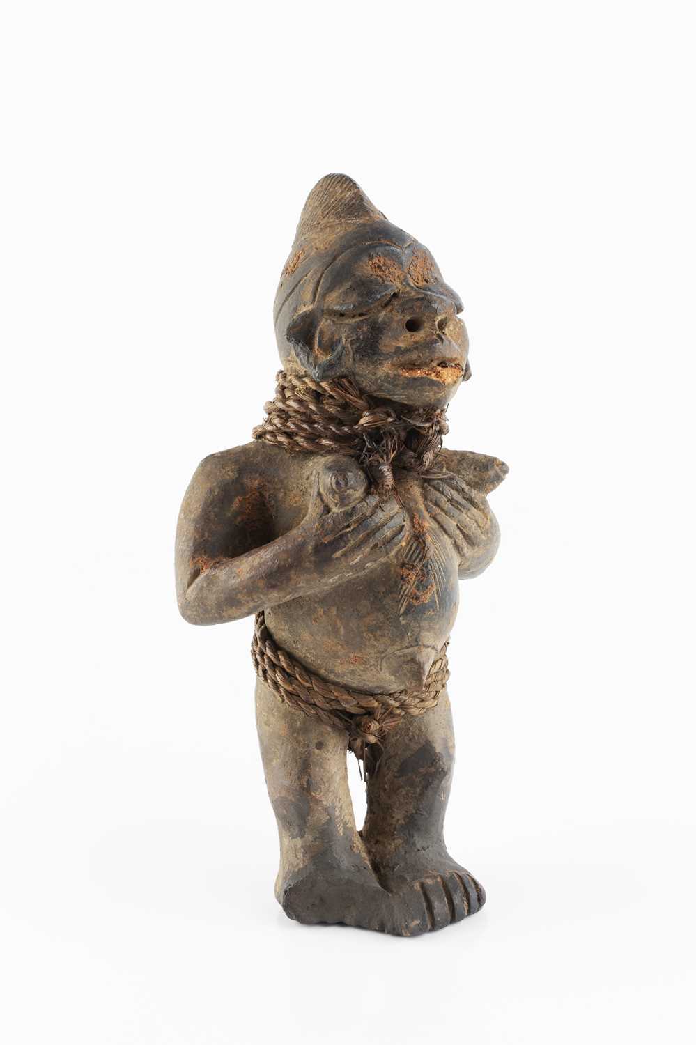 Lot 363 - A Yoruba Shango clay figure, in the form of a...