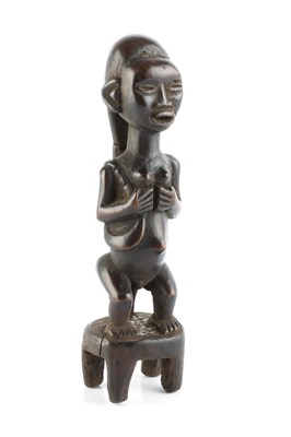 Lot 370 - A Bembe/Hamba wooden figure carved in the form...