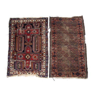 Lot 187 - Caucasian red ground rug with panels of...