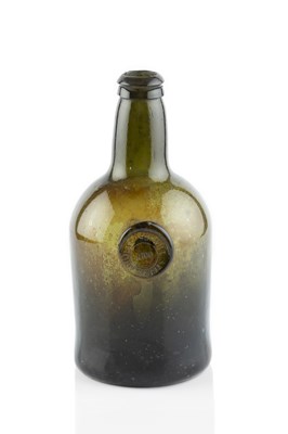 Lot 82 - A sealed and dated wine bottle, squat cylinder,...