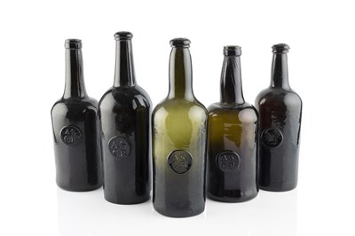 Lot 103 - A group of five sealed wine bottles, cylinders,...