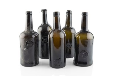 Lot 105 - A group of five sealed wine bottles, cylinders,...