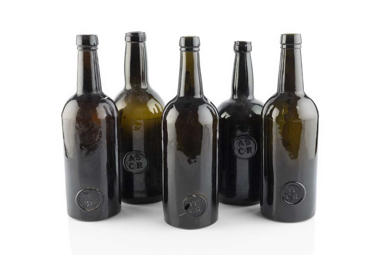 Lot 107 - A group of five sealed wine bottles, cylinders,...