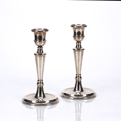 Lot 507 - Pair of silver candlesticks filled, with...