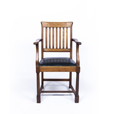 Lot 89 - In the manner of Heals Oak armchair with...