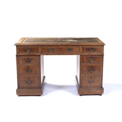 Lot 173 - An Edwardian oak pedestal desk, the top with...