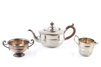 Lot 378 - A silver tea pot and milk jug, of circular...