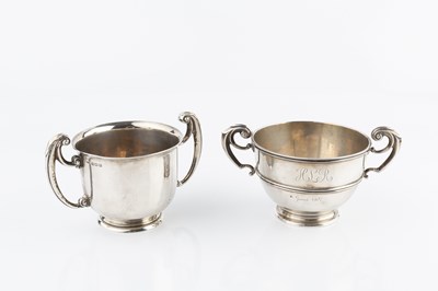 Lot 381 - An Edwardian silver twin handled cup, with...