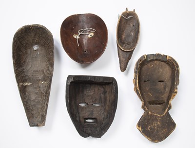 Lot 312 - Tribal interest, a group of five masks, all...