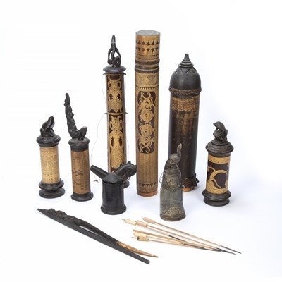 Lot 318 - A collection of Indonesian carved wood and...