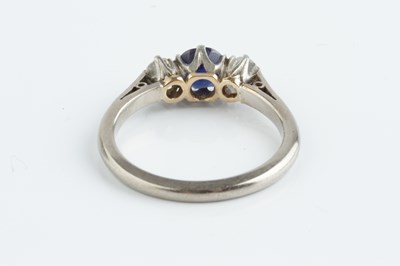 Lot 141 - A sapphire and diamond three stone ring, the...