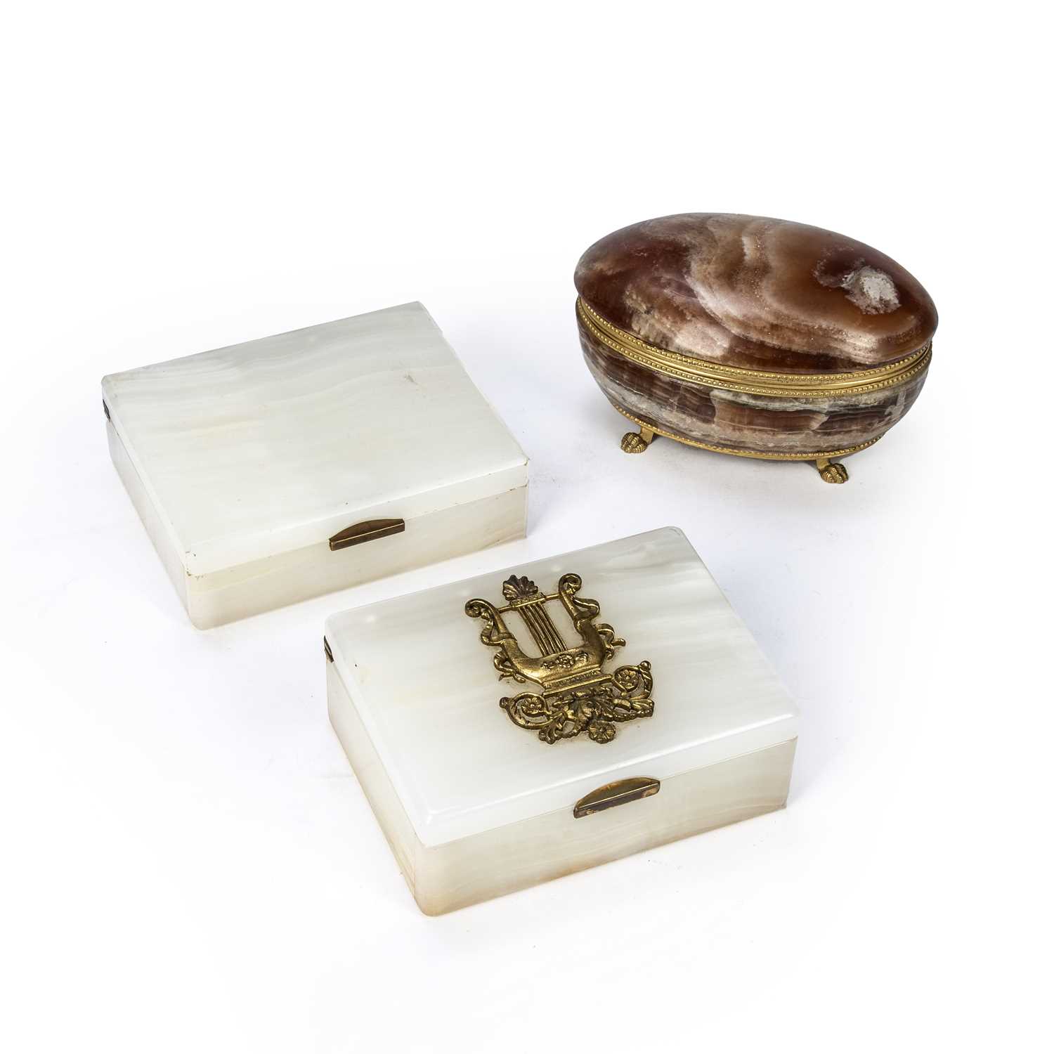 Lot 227 - Two Art Deco white onyx cigarette boxes, by...