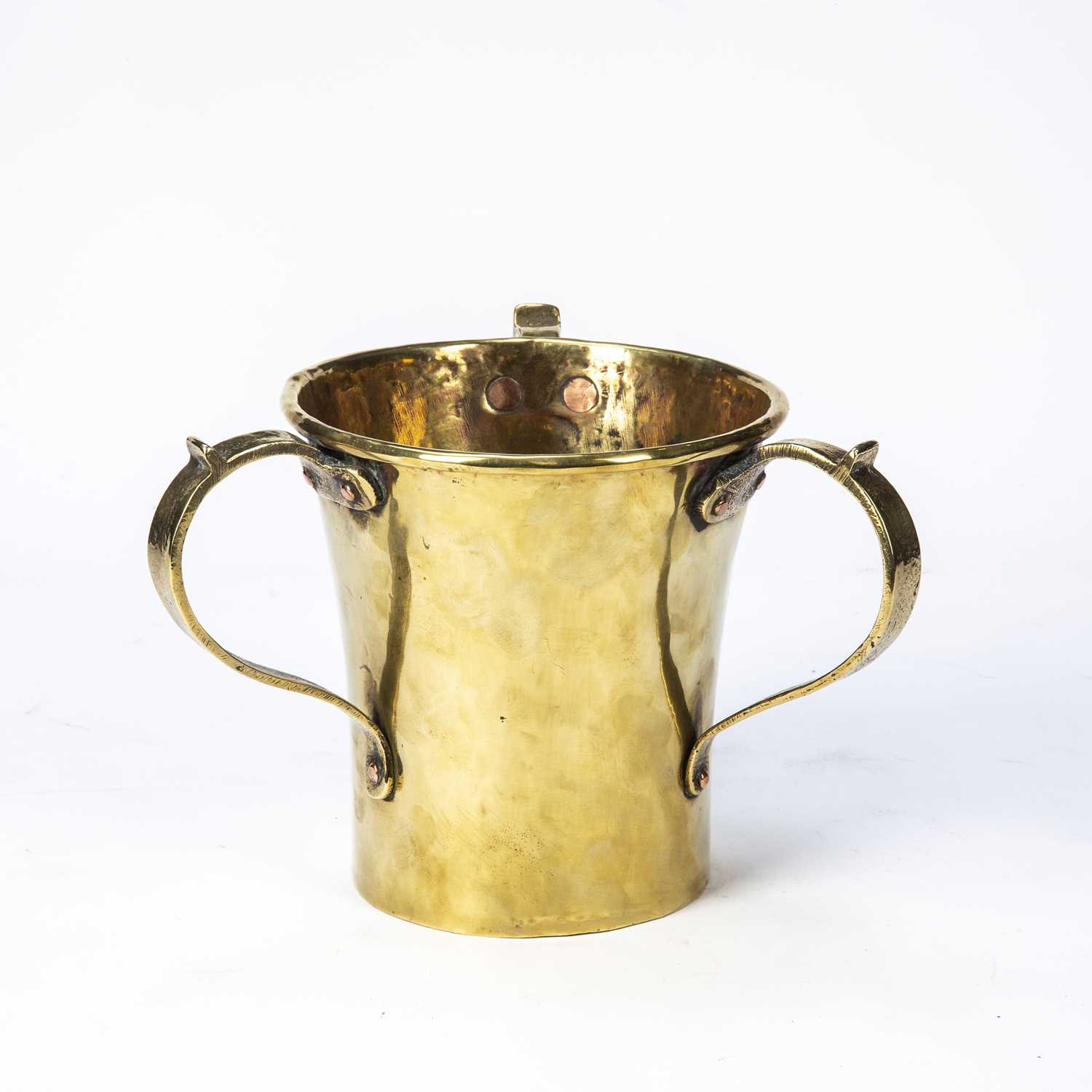 Lot 229 - A Russian Arts and Crafts style brass...