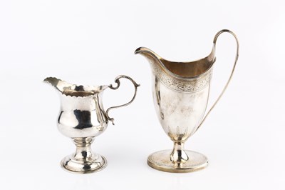 Lot 383 - A George III silver helmet shaped cream jug,...