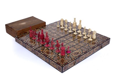 Lot 234 - A Moorish inlaid mosaic wooden folding chess...