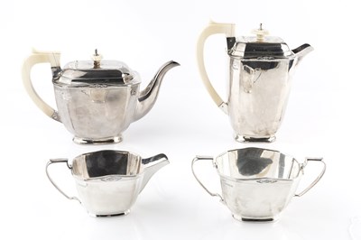 Lot 410 - An Art Deco style silver four piece tea...