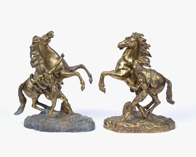 Lot 117 - A pair of cast gilt metal figures of Marly...