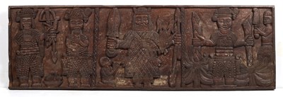 Lot 343 - A Benin carved wood rectangular panel, a...