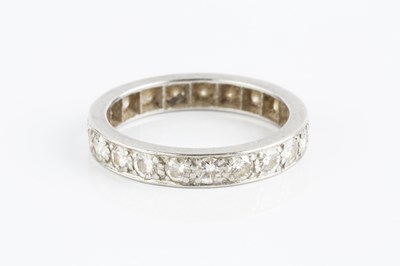 Lot 188 - A diamond full hoop eternity ring, set...