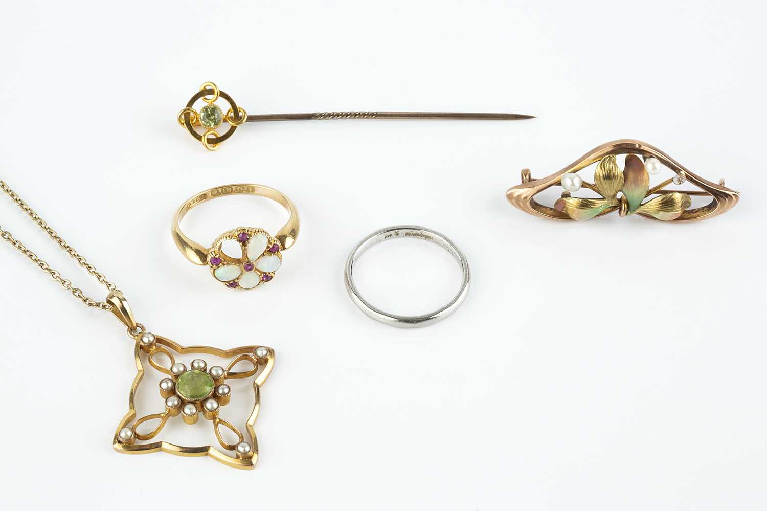 Lot 76 - A peridot and half pearl pendant on chain, the...