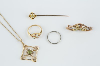 Lot 76 - A peridot and half pearl pendant on chain, the...