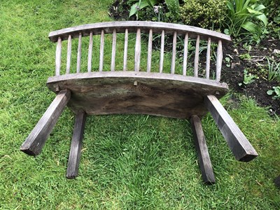 Lot 688 - A large circular oak garden table and eight...