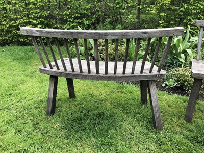 Lot 688 - A large circular oak garden table and eight...