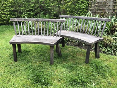 Lot 688 - A large circular oak garden table and eight...