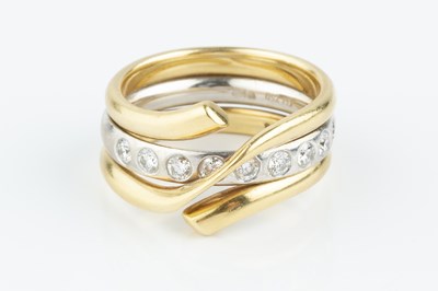 Lot 102 - A diamond set 'Magic' combination ring by...