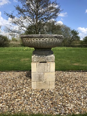 Lot 691 - An old cast reconstituted stone fluted bowl on...